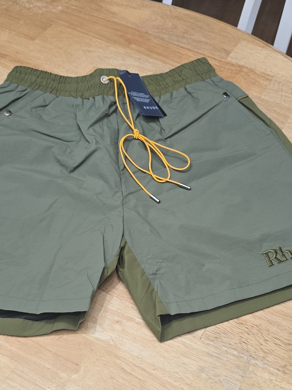 Rhude Olive Green Athletic Shorts with Yellow Drawcord